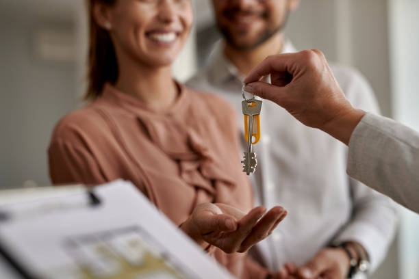 buyer receiving key to new home